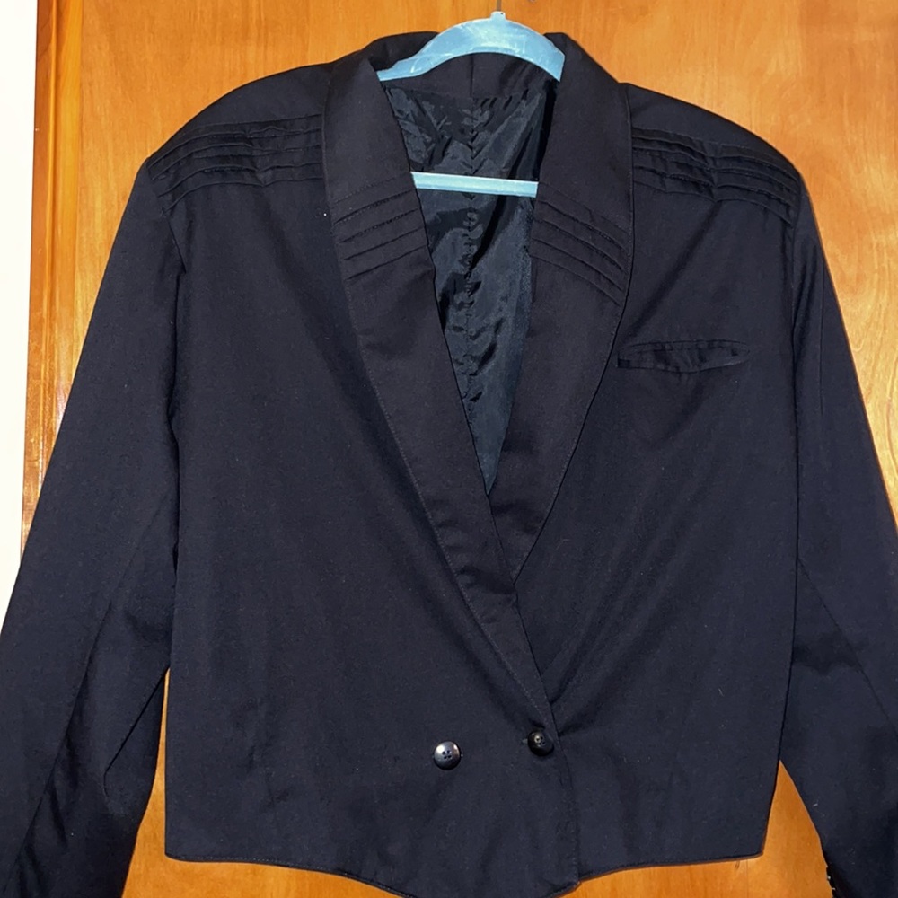 Black jacket and creased pants